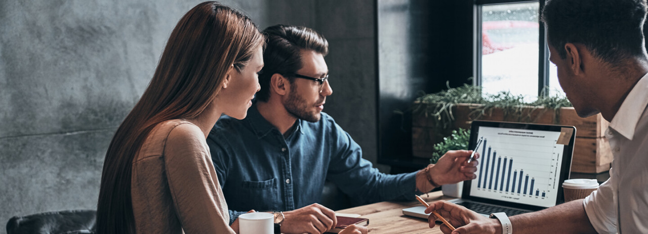 colleagues-discussing-reports-1124272546-2048x2048