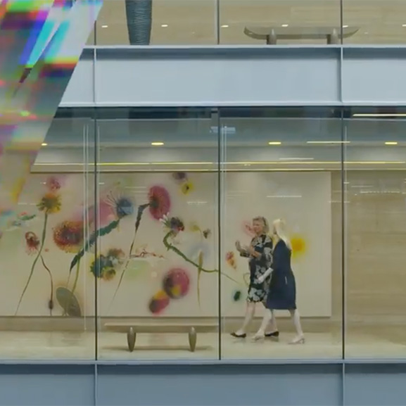 Two women walking down hall
